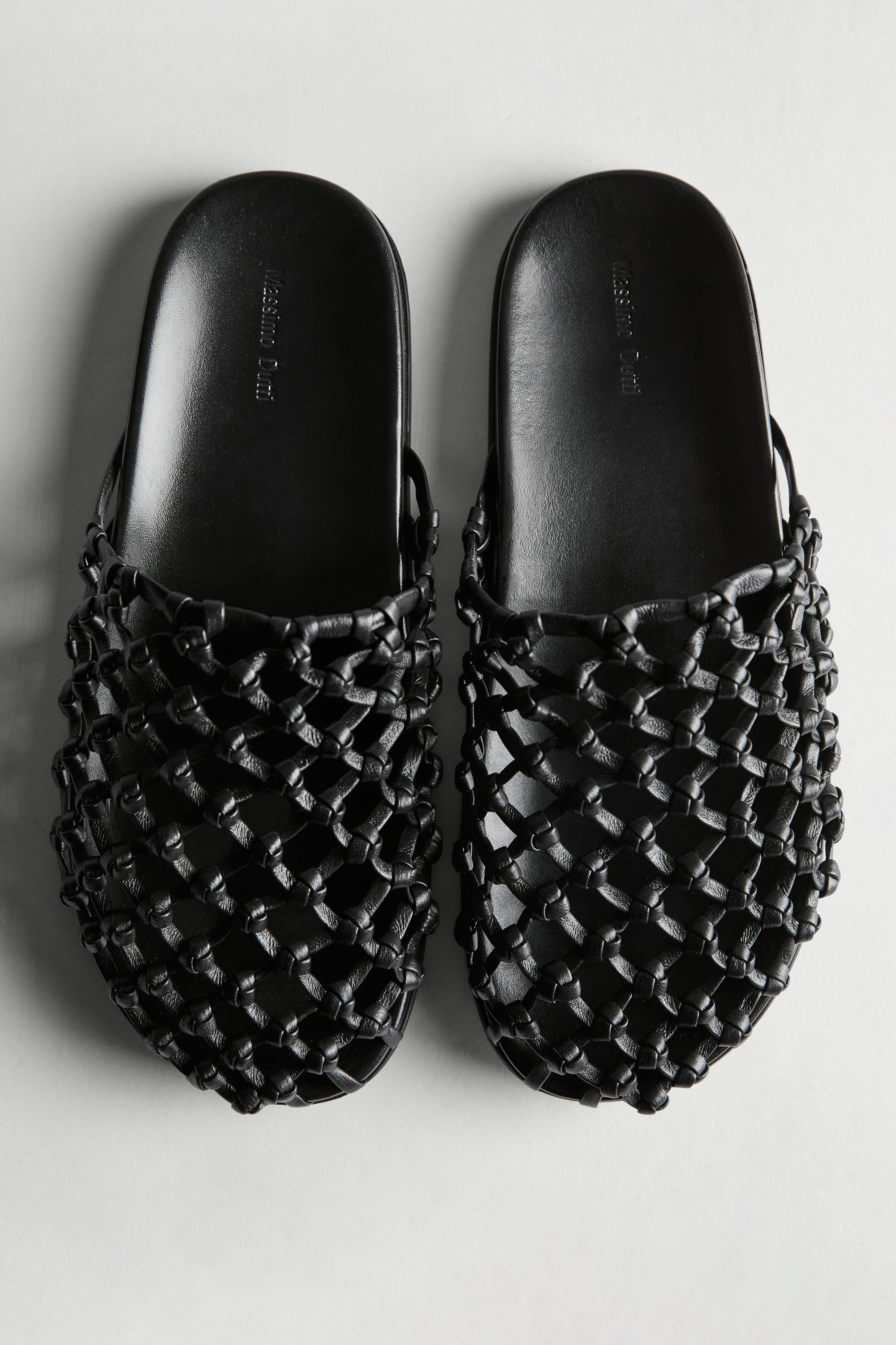 Woven leather clogs
